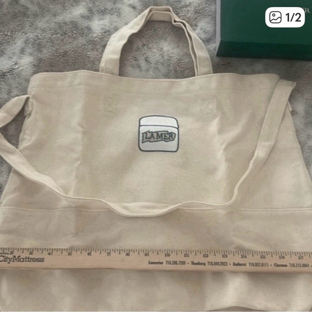 La Mer Tan Canvas Duffel Bag